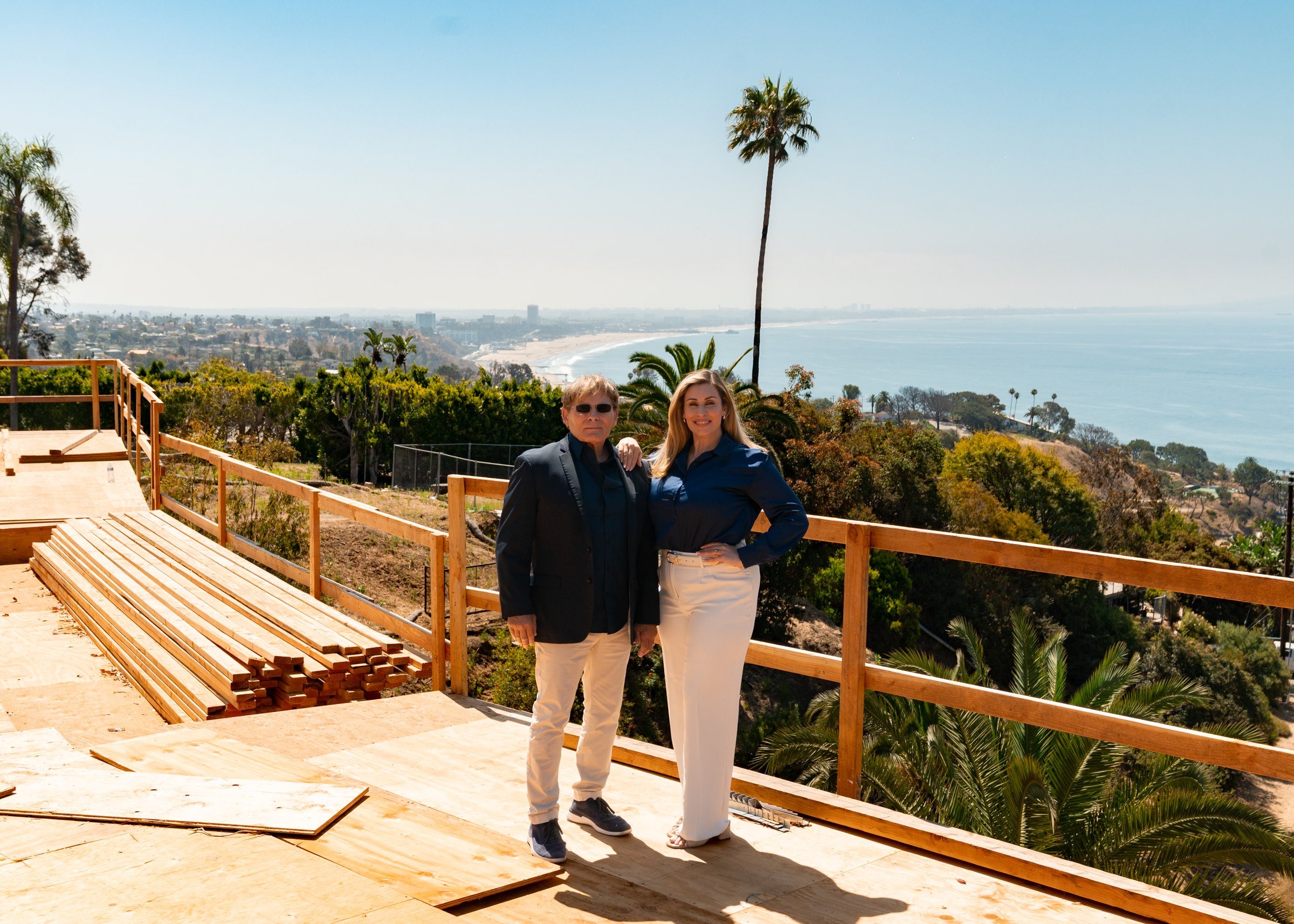 Mike and Christine Ross on the deck of a Pacific Palisades site