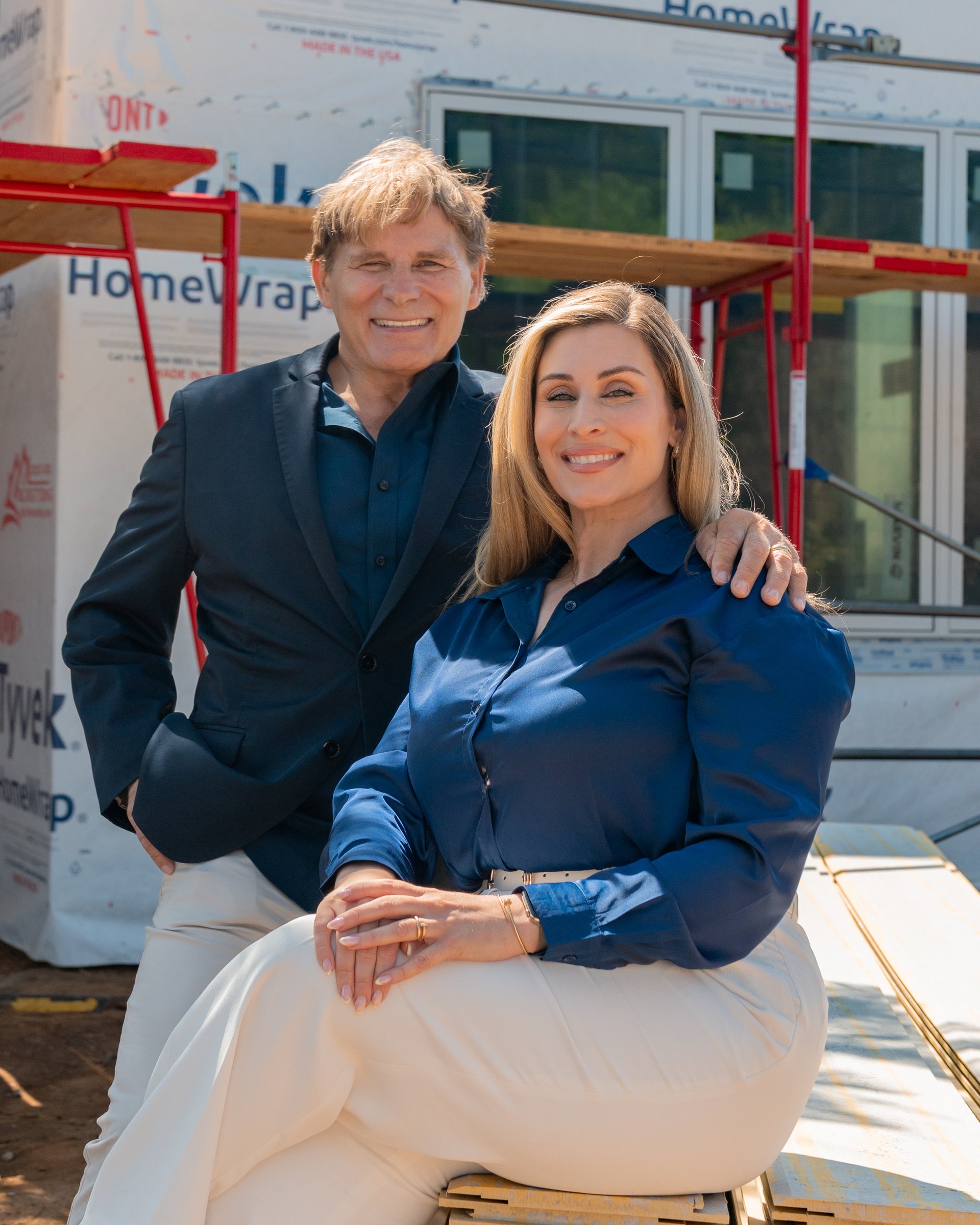 Mike and Christine Ross at a wrapped rebuild