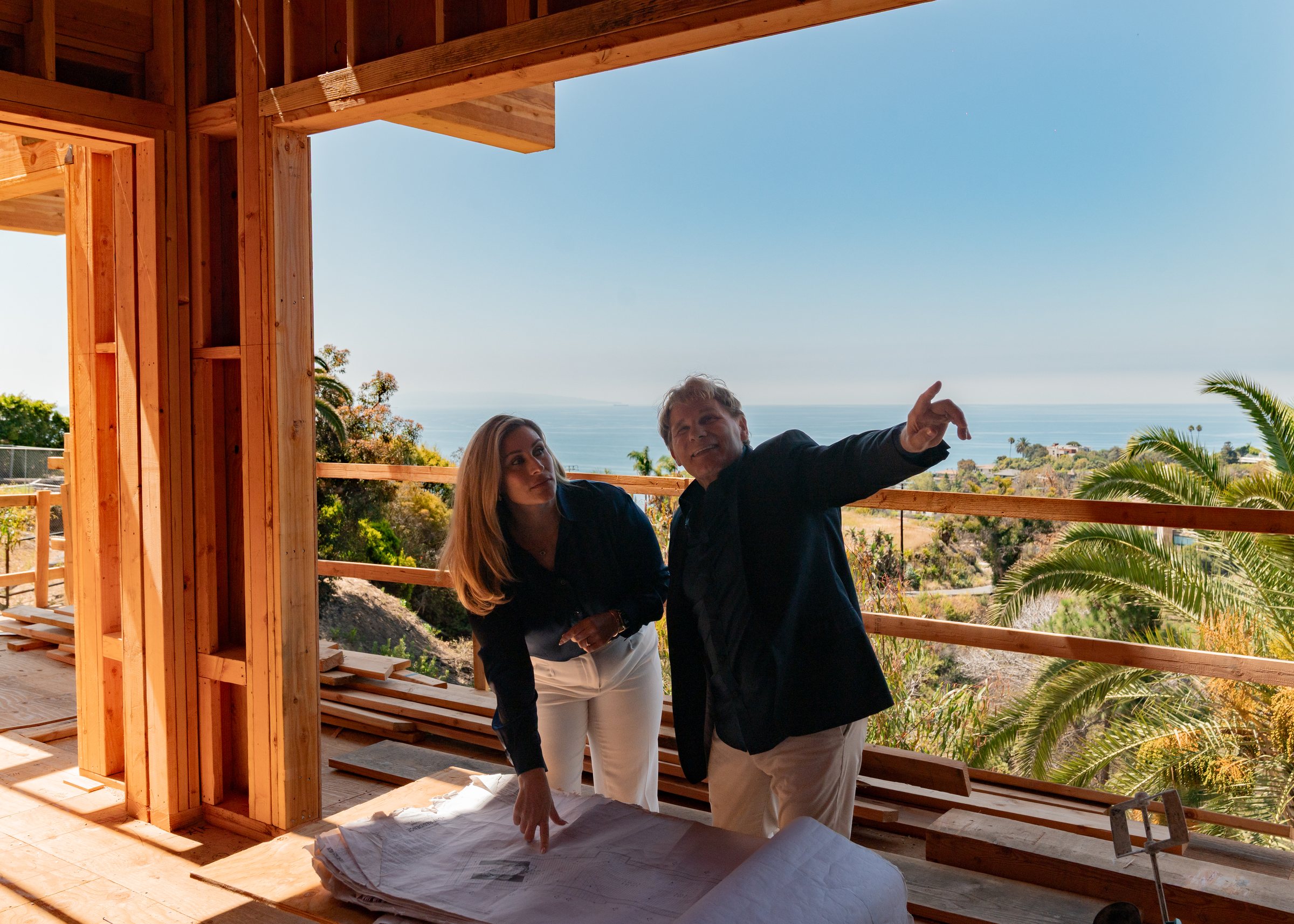 Mike Ross pointing out a view to Christine Ross on site