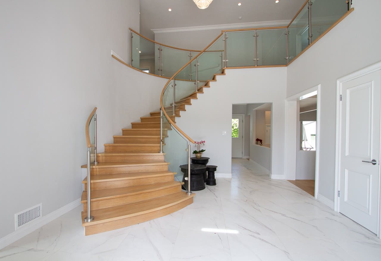 Benedict Canyon foyer with a curved stair